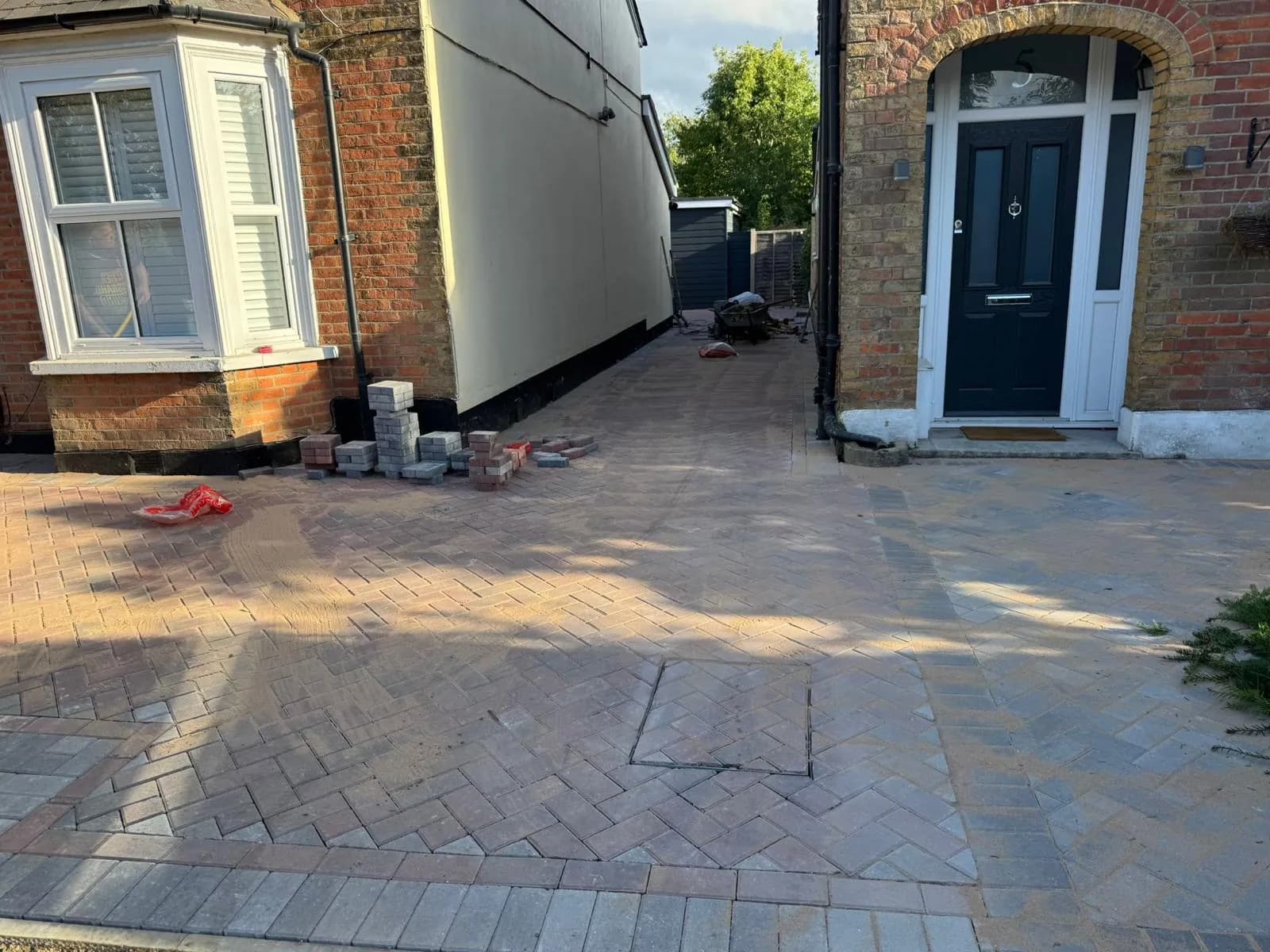 Finished block paved path down the side return