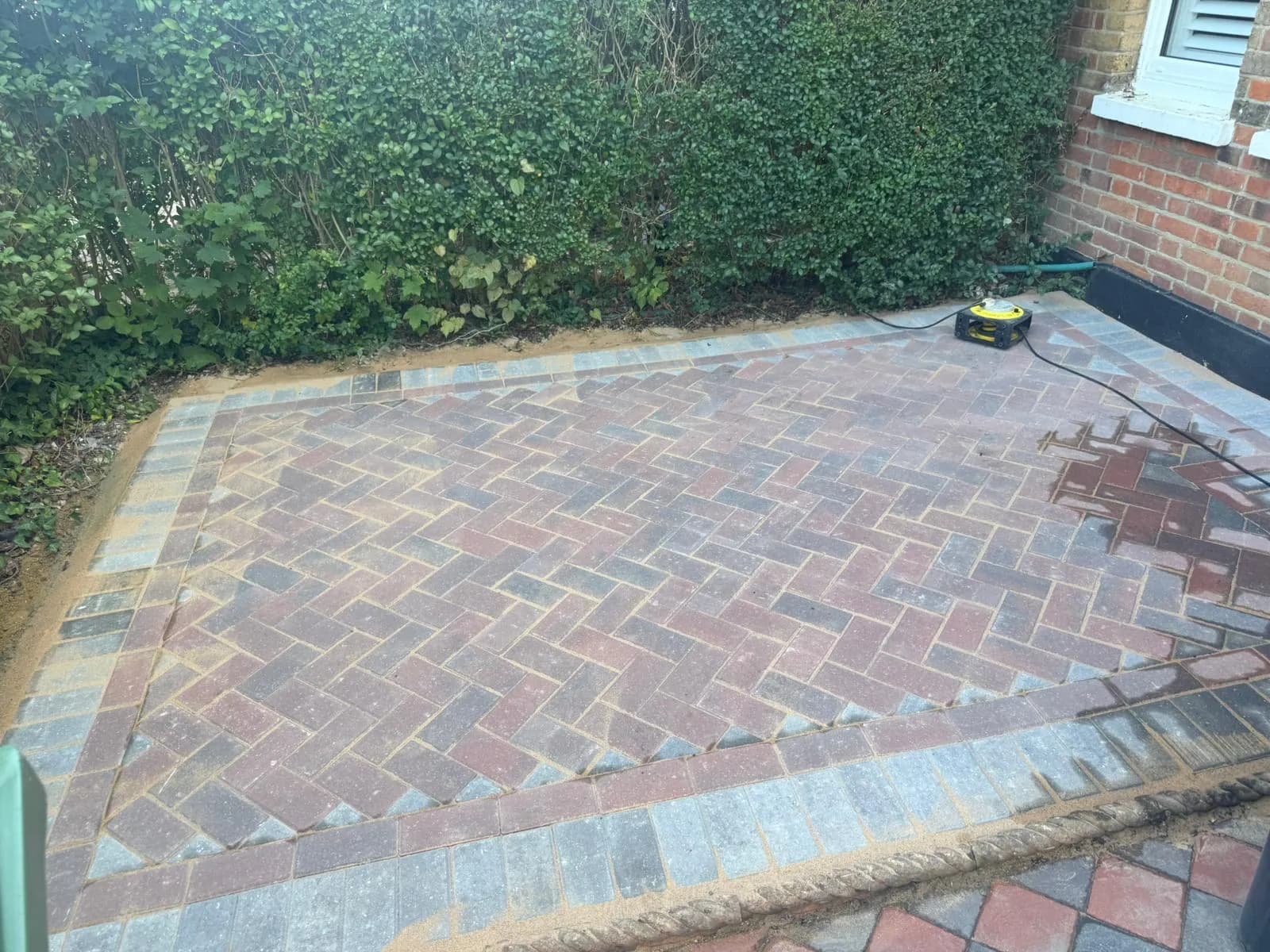 Finished brindle block paving in the rear courtyard