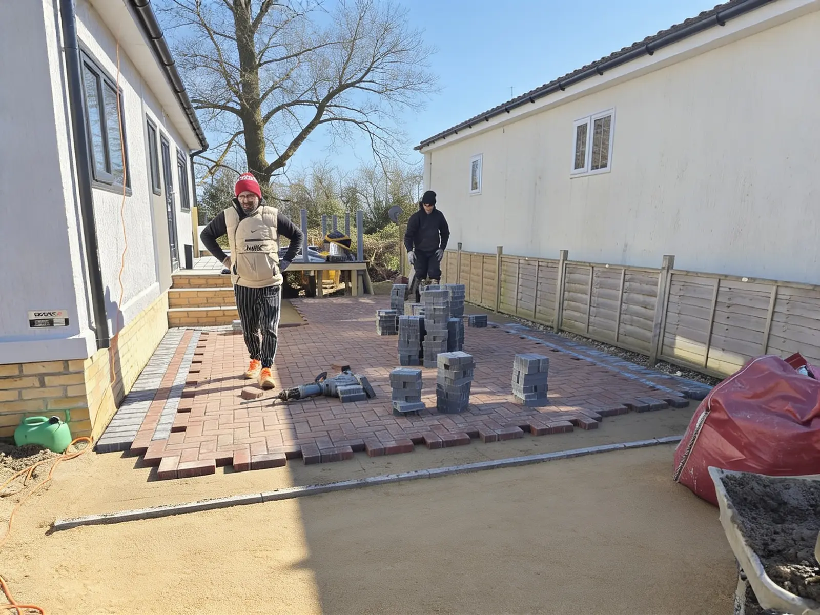Block paving driveway taking shape with the soldier-course edge