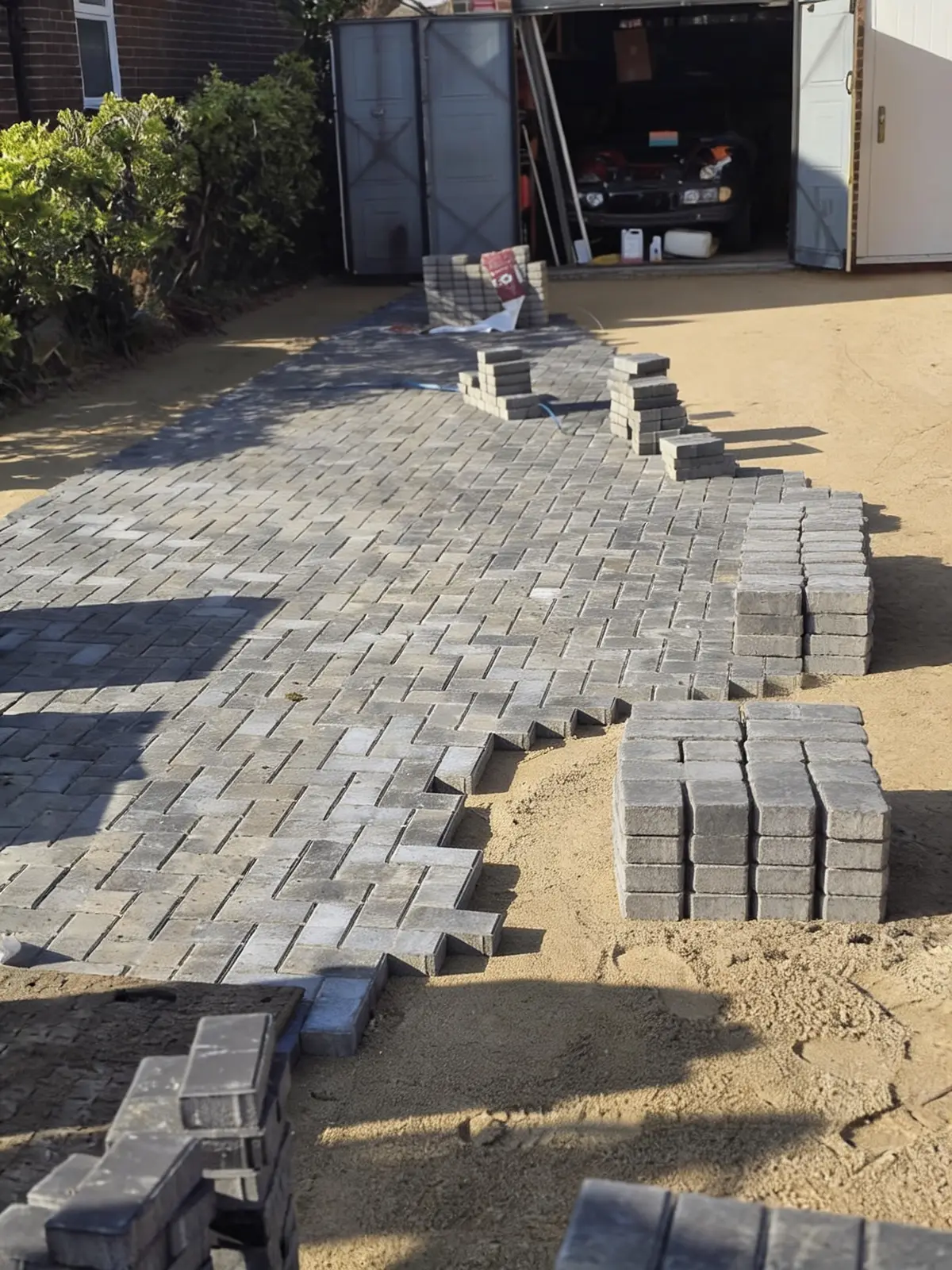 Laying the charcoal blocks in a stretcher-bond field