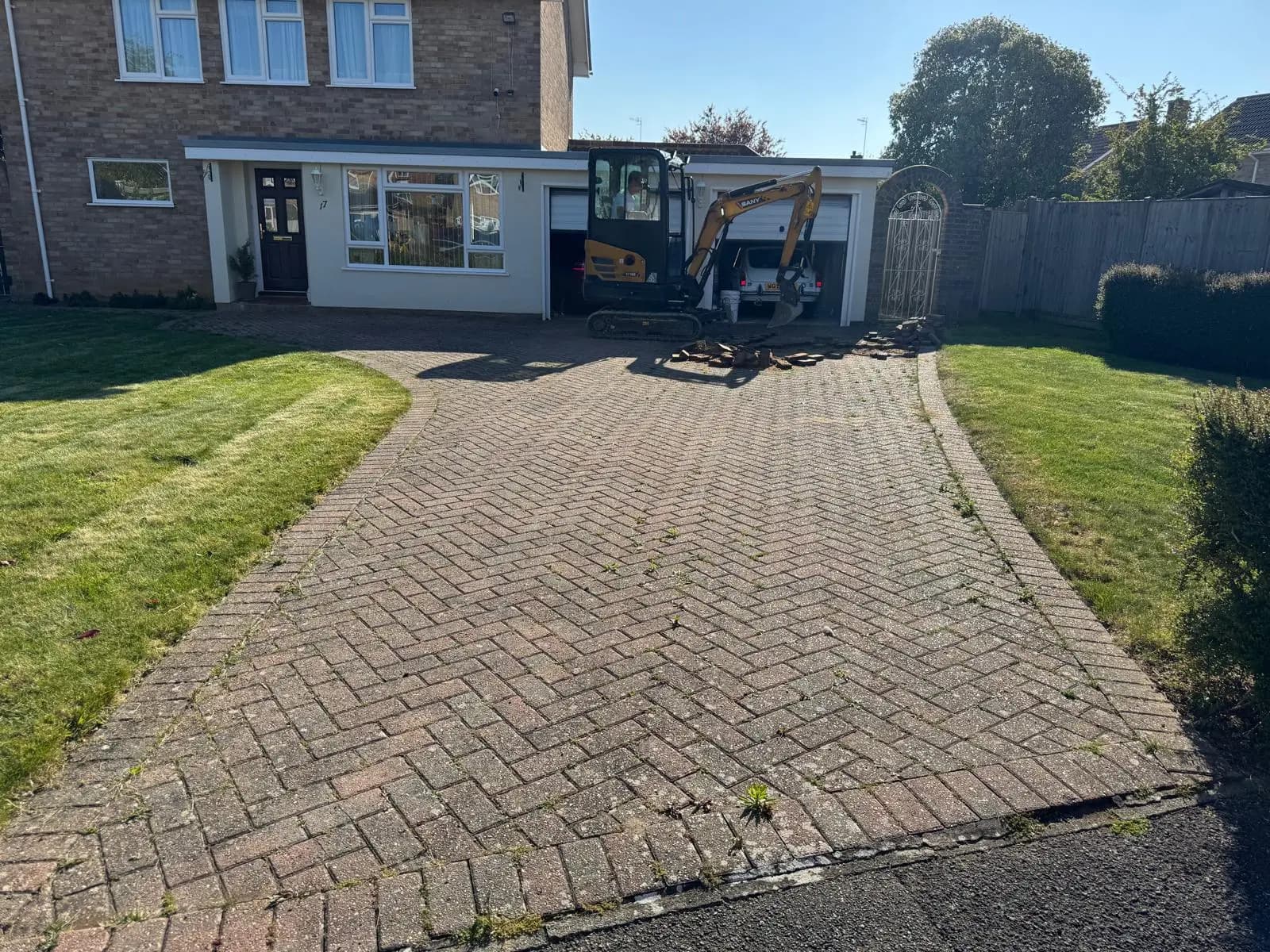The old, faded block paving driveway before the works