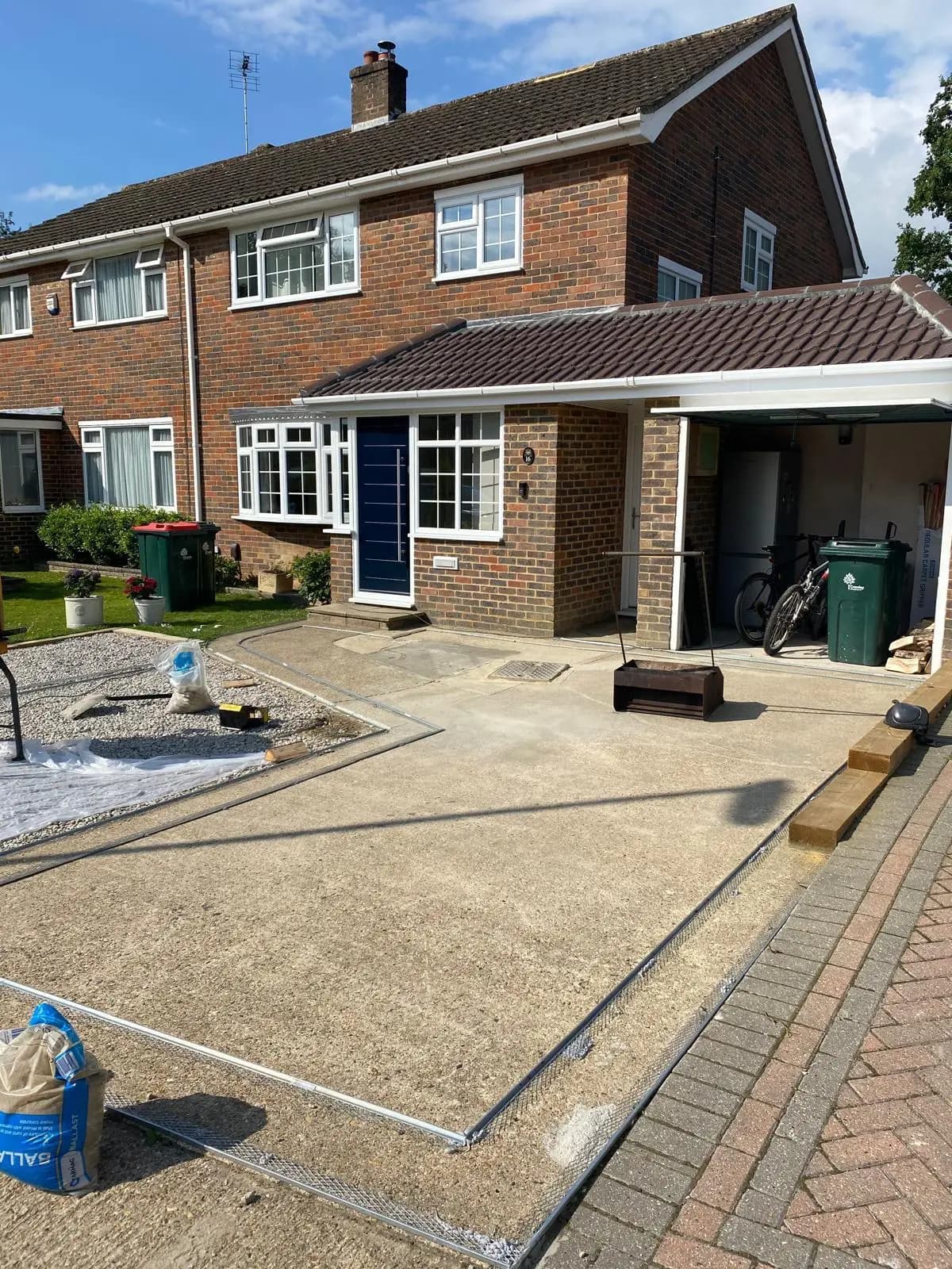 Worn concrete driveway before resurfacing