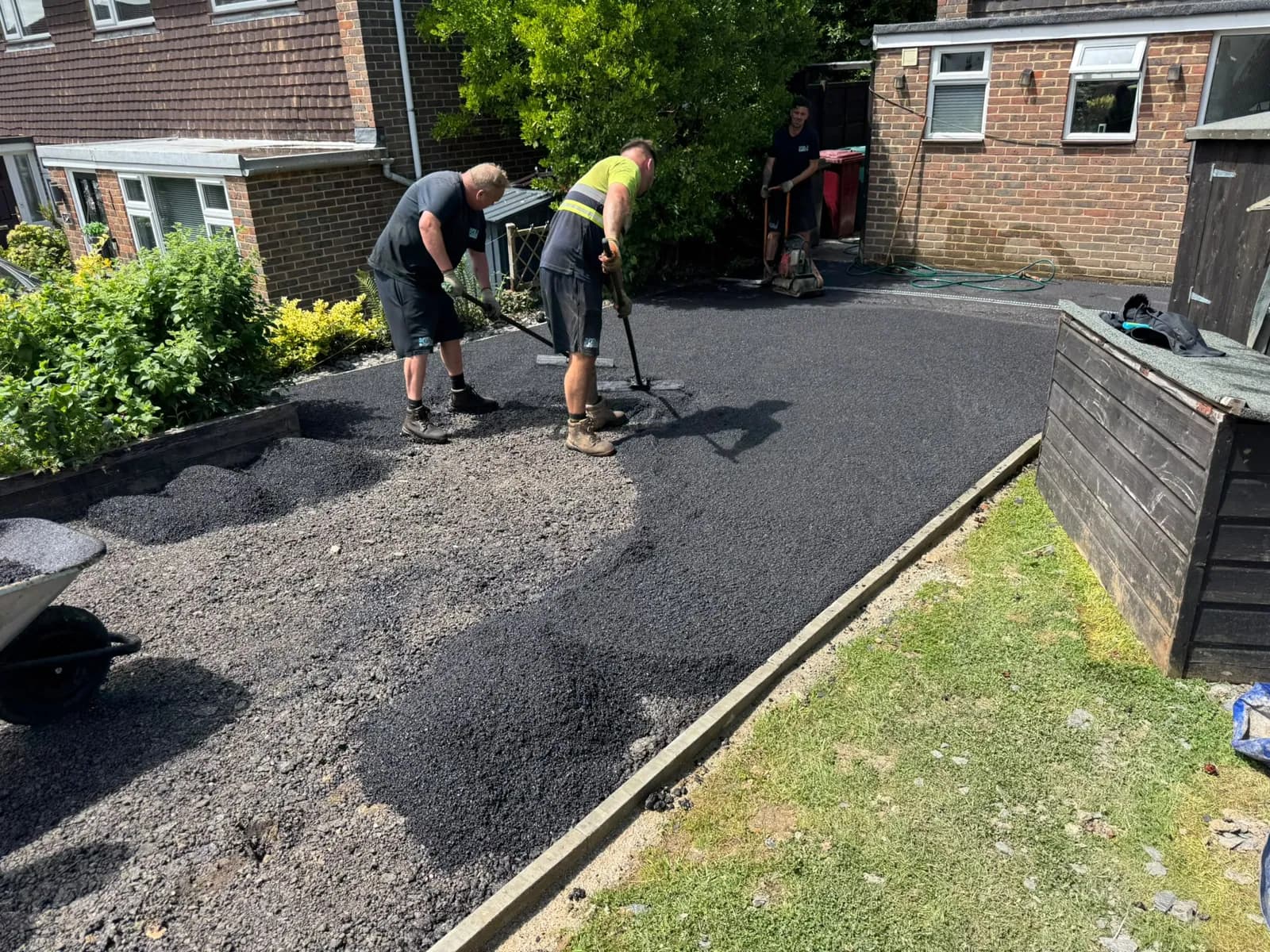 The new tarmac surface going in along the full length of the drive
