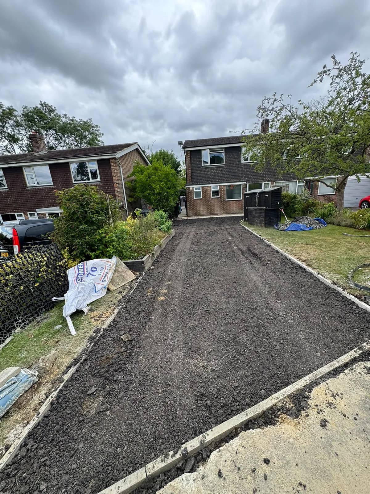 Finished tarmac driveway looking back toward the road