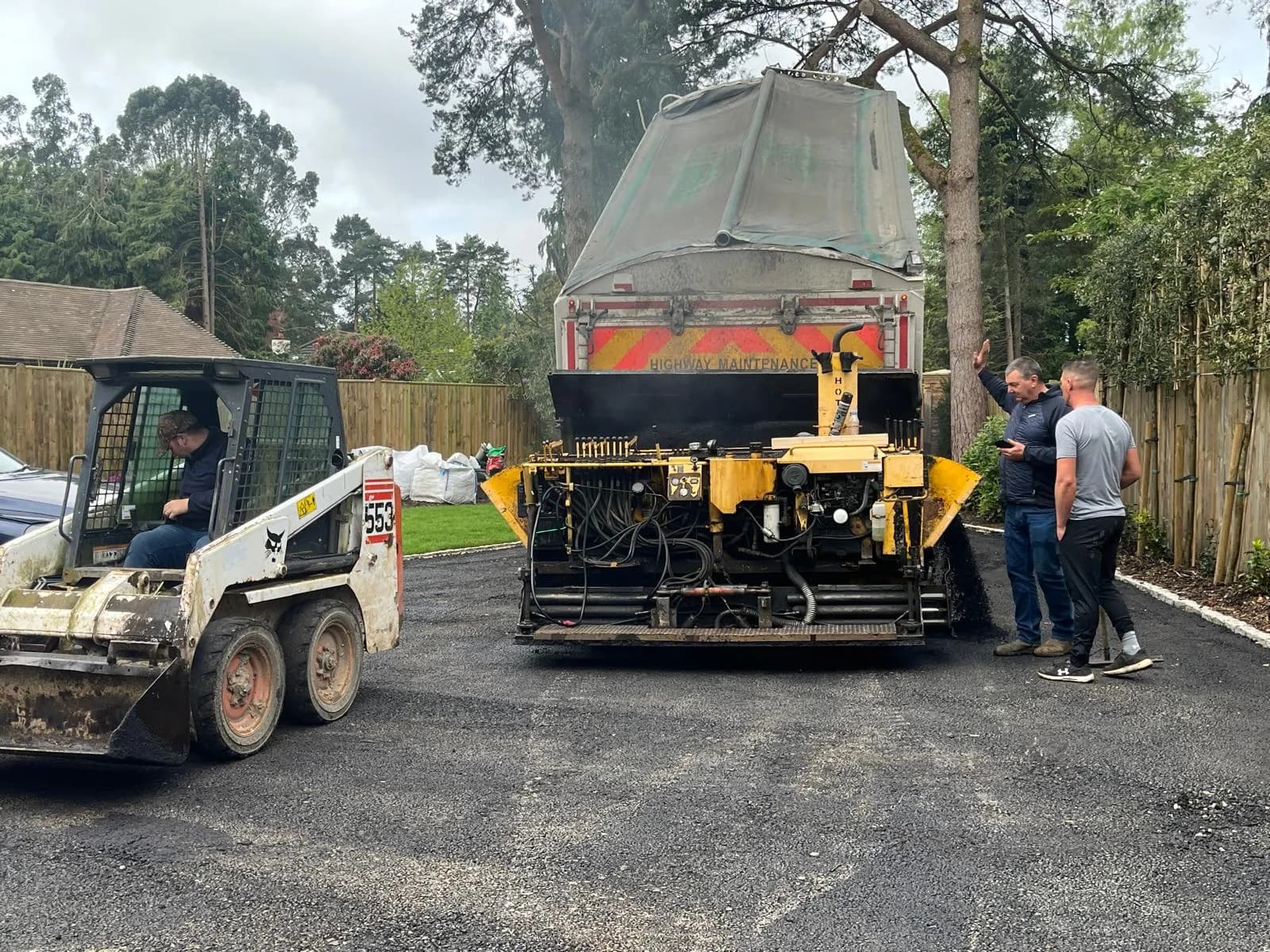 Rolling the new tarmac surface in