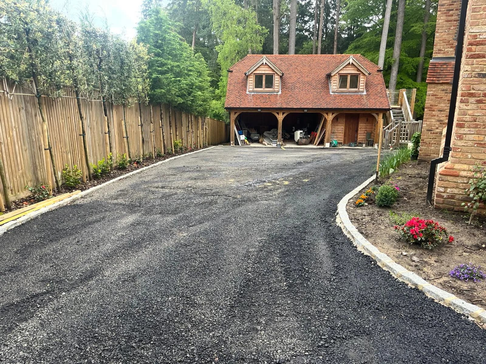 The finished tarmac driveway sweeping up to the house