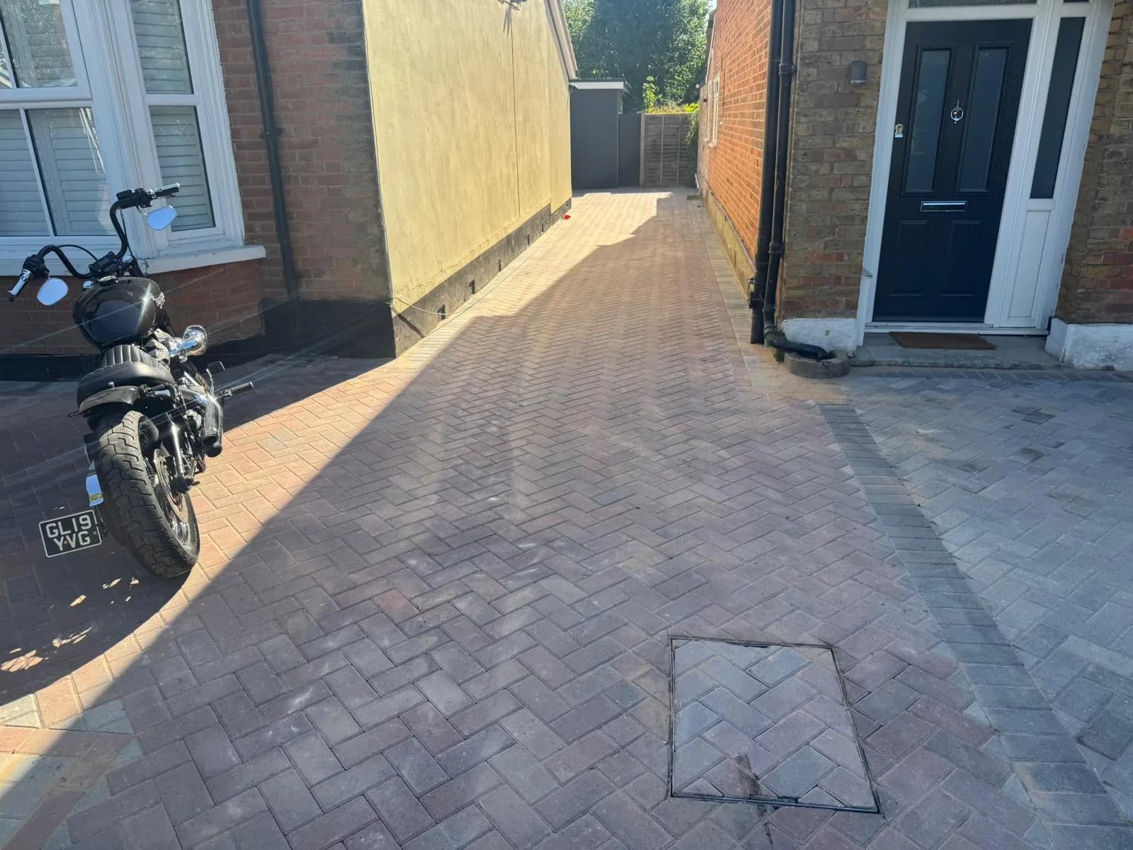 Finished brindle block paving courtyard between period houses