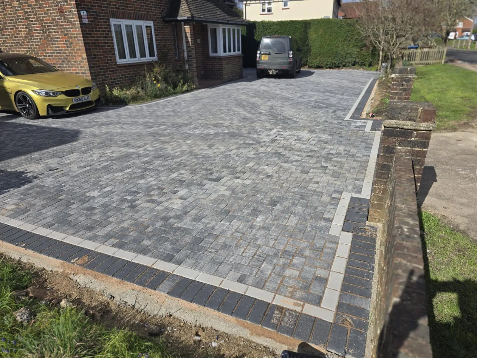 Charcoal block paving driveway outside a Surrey home