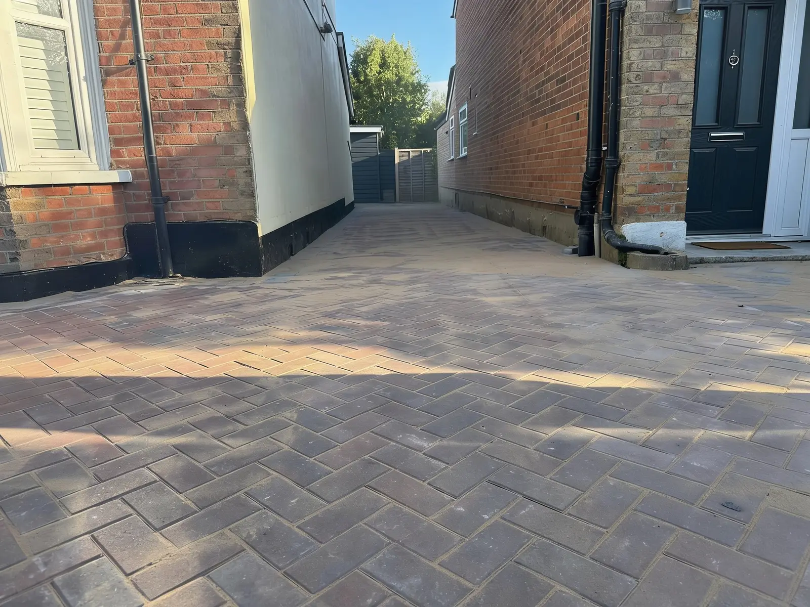 Finished block paving driveway laid in herringbone pattern