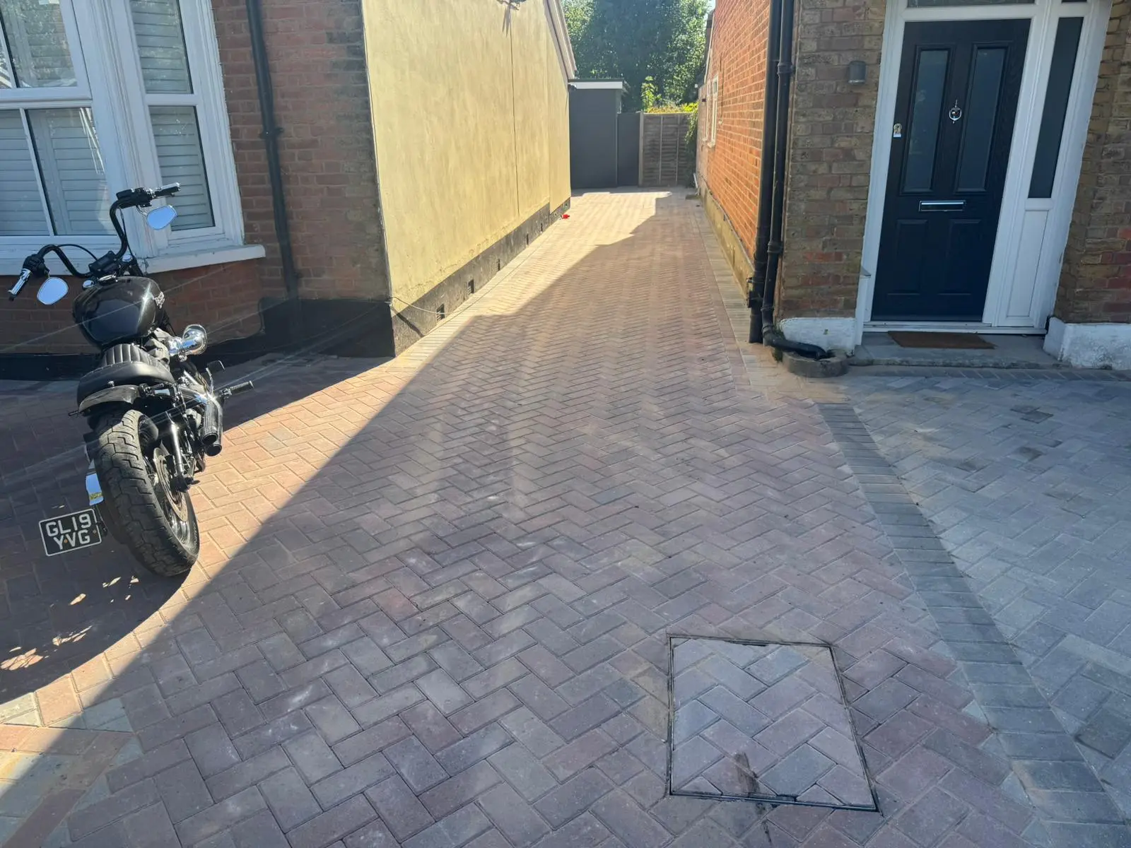 Finished brindle herringbone block paving driveway at a period Surrey home