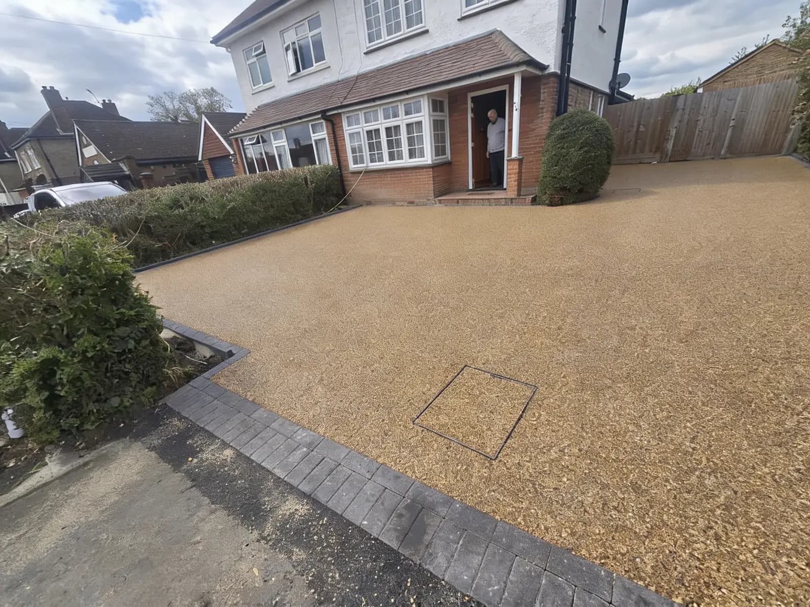 Finished gold resin-bound driveway in front of a Surrey home