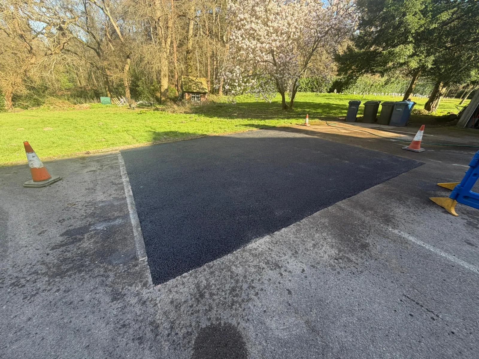 Finished tarmac surfacing in the grounds of a church in Shere