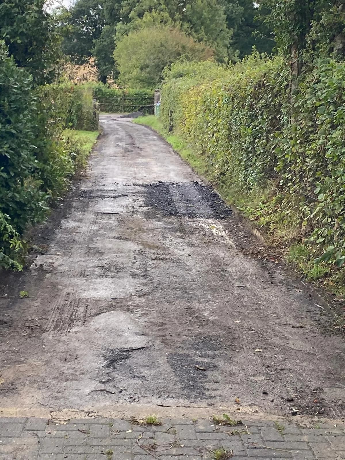 Broken-up road surface in need of repair